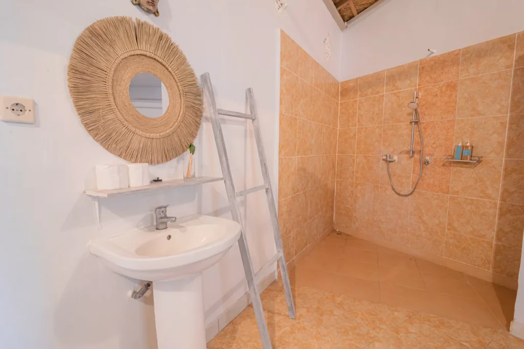 Beachfront suite ensuite bathroom at SALT Bali