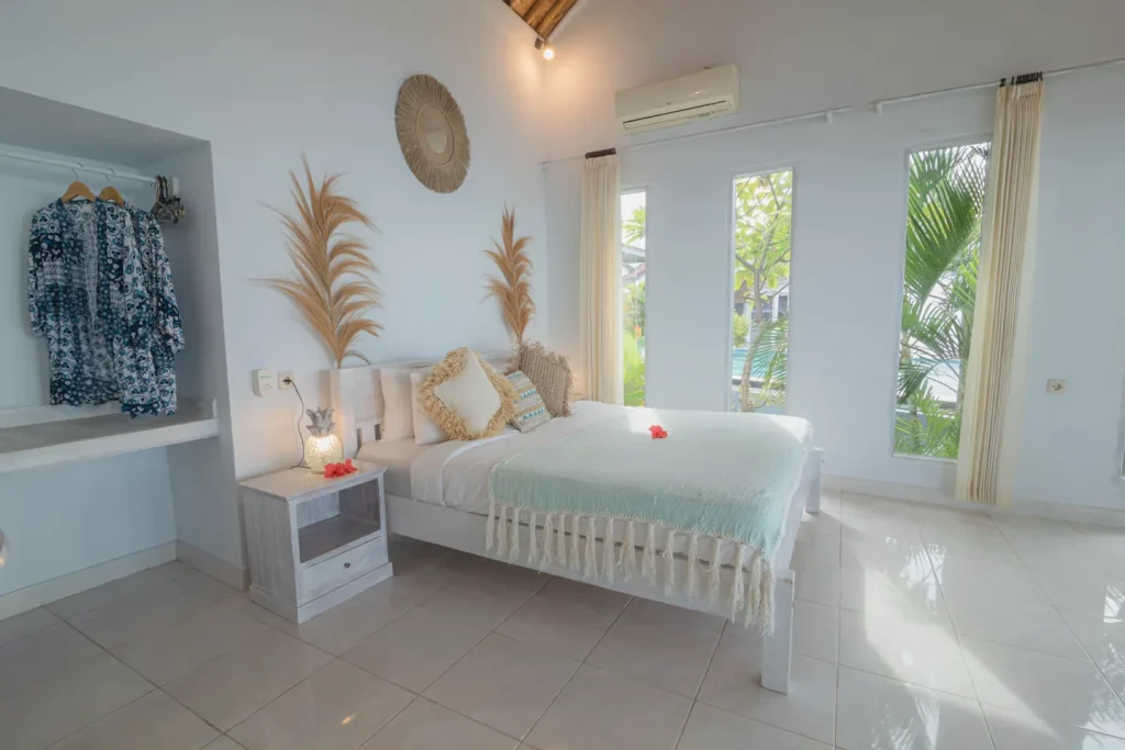 Beachfront suite king bedroom at SALT Bali