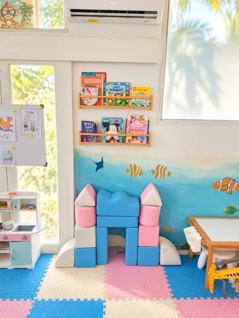 Toy and book storage area inside Salty Monkeys Kids Club at SALT Bali